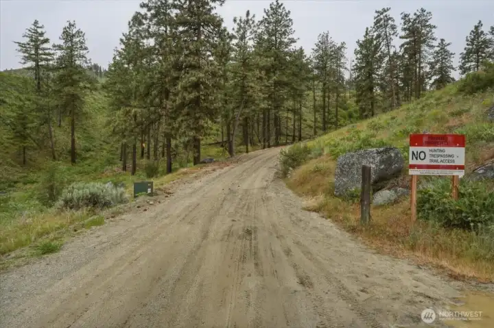View of Washington Creek Rd on road to property. View of Washington Creek Rd on road to property.