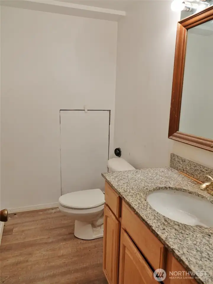 Downstairs 1/2-bath. Downstairs 1/2-bath.