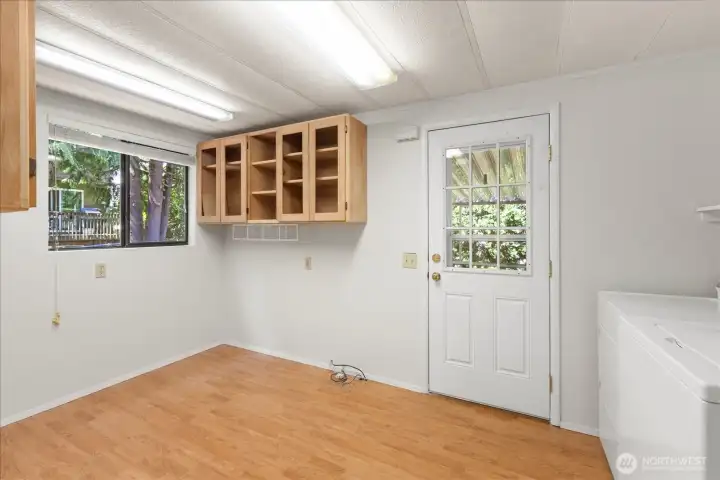Back entrance flows into multipurpose room...great for storage/office/exercise as well as your laundry.