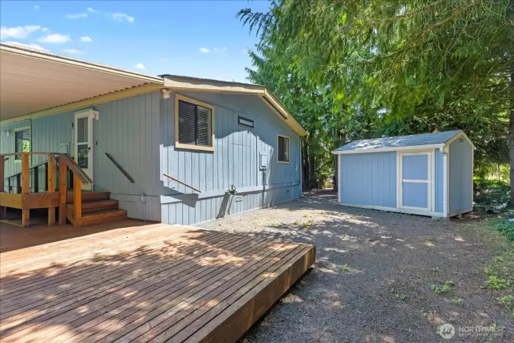 Spacious back deck and large shed.