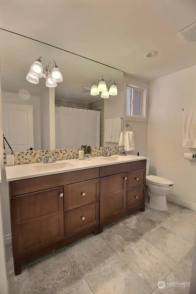 Guest Bath with double vanity & tub/shower.