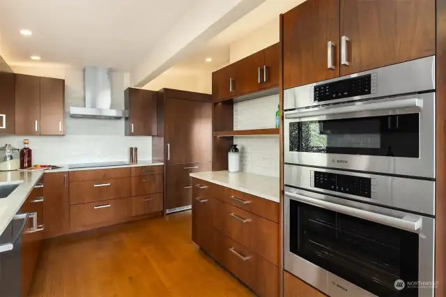 Double oven, induction cooktop, quiet dishwasher, built-in refrigerator.