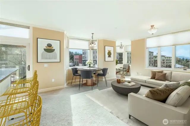 The entry hall, with both a coat and linen closet, leads you to a light and bright kitchen and living room space. This expansive open space offers south and west facing views of Fairhaven, plus breathtaking views of Bellingham Bay and Lummi Peak.