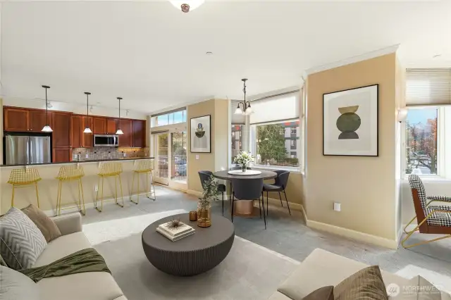 The open concept space offers a kitchen seating area in addition to a dining nook, and living area. At the far corner you'll find a welcoming and cozy reading nook overlooking the Fairhaven shopping core. (Photo depicts virtual staging.)