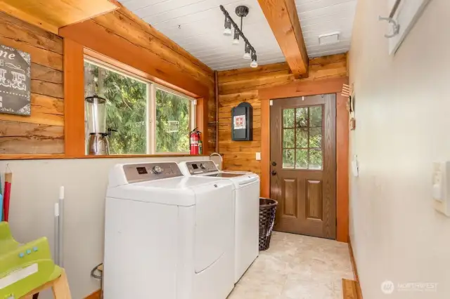 Utility/laundry room walks out onto wrap around deck to front of home.