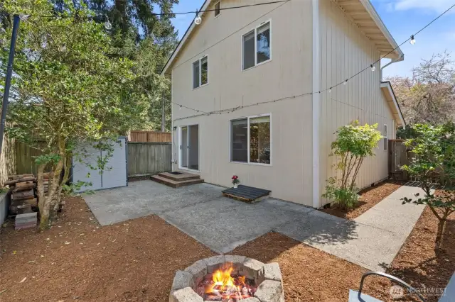 Private backyard with entrance to dining room and gate leading to front of house.