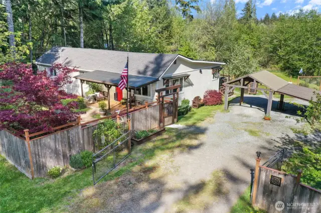 A gated entry greets you at this gardener's delight.
