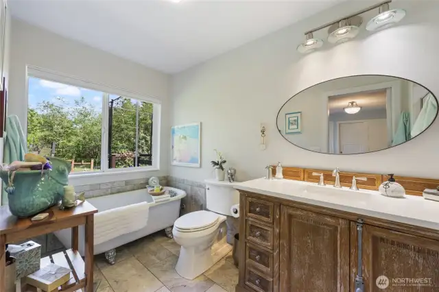 Primary Bath with clawfoot tub and walk in shower!