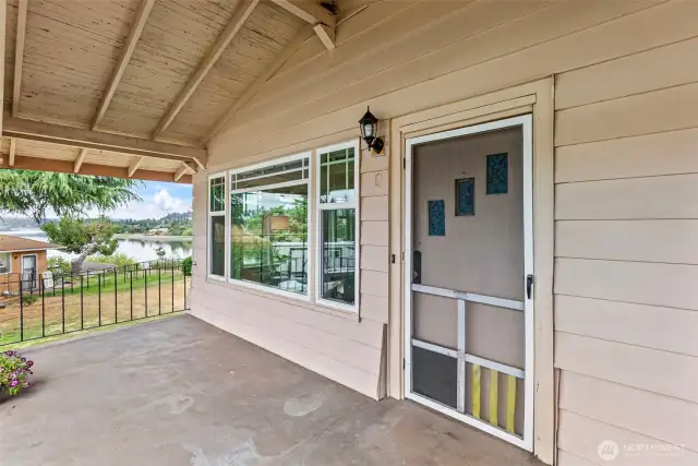 Covered front porch looking toward the water.