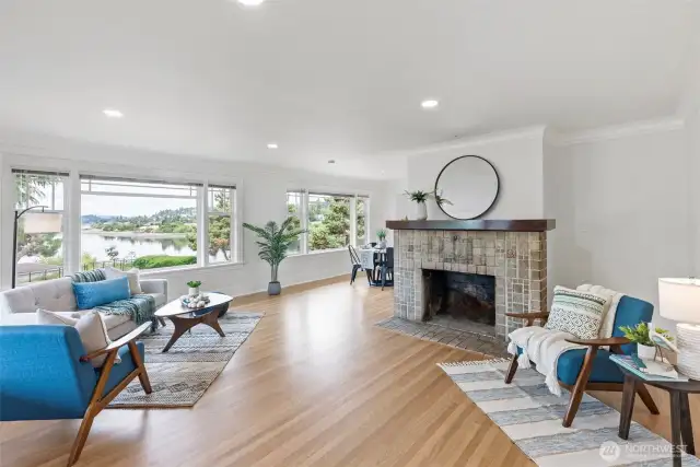 Here's another view of the living room. Decorative brick fireplace adds a touch of charm.