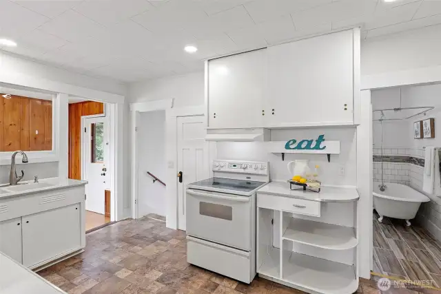 Opposite wall of kitchen, small pantry to left of stove and solarium to the left.