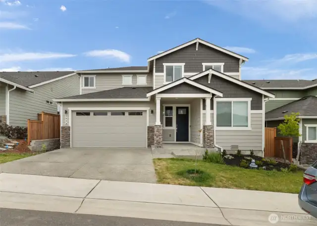 Modern curb appeal in the heart of McCormick Trails — Clean lines, fresh exterior colors, and a welcoming covered entry set the tone for style and comfort throughout.