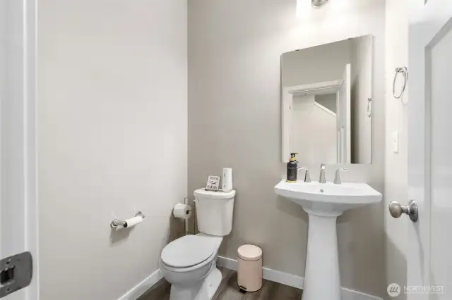 Stylish and convenient main floor powder room — Perfectly placed for guests, with modern fixtures and a clean, timeless design that blends seamlessly with the rest of the home.