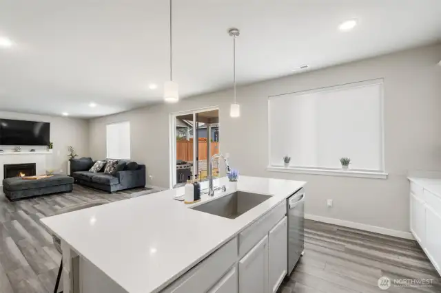 Enjoy effortless connection from the kitchen to the great room and out to the covered patio, blending indoor comfort with outdoor living in true Northwest style.