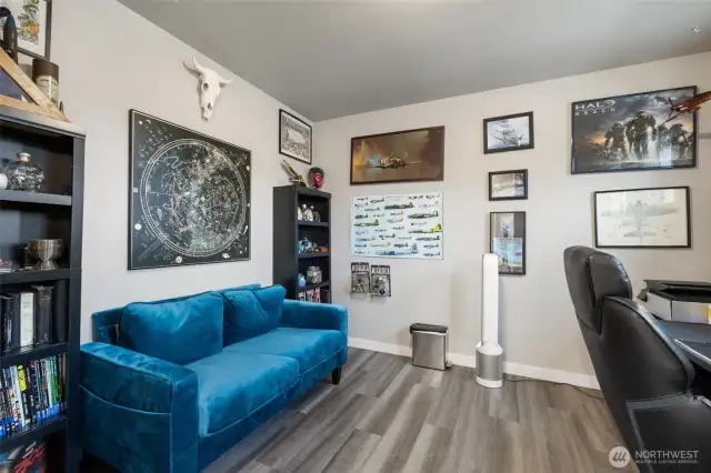Closet? Office? Why not both.  Tucked away behind the primary suite, this flexible space adds surprising function with room for a desk, seating, and inspiration to spare.