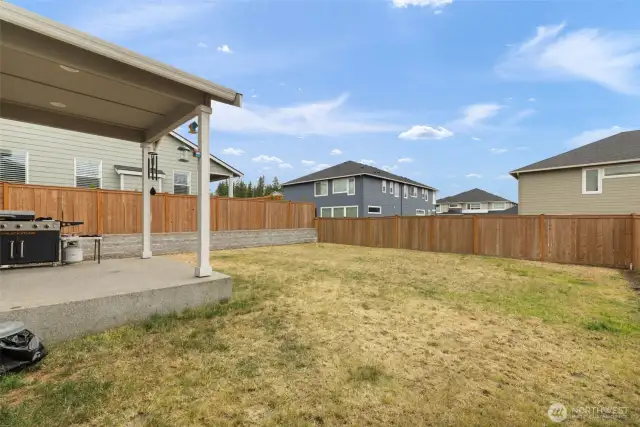 This fully fenced, flat backyard offers a safe and spacious canvas for gardening, entertaining, or letting pets and kids run free.