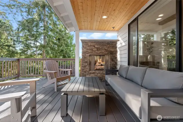 Expansive deck with covered area and fireplace