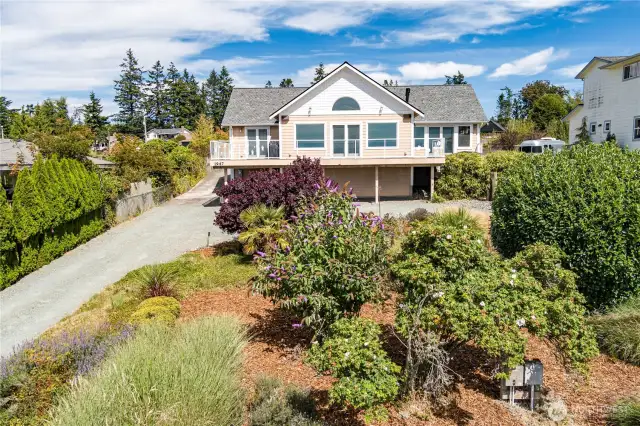 Set back from the road for wonderful privacy.  Lovely front yard gardens