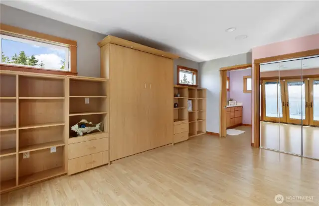 2nd bedroom Murphy bed.  Built on bookcases and a private door to the main bath
