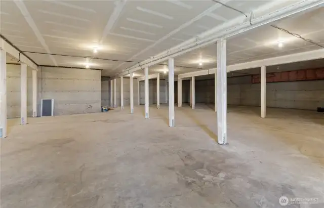 Semi finished basement houses furnace(radiant floor heat boiler) hot water and electric boxes.  Room to create more living space / great shop area.  Access is door under the deck
