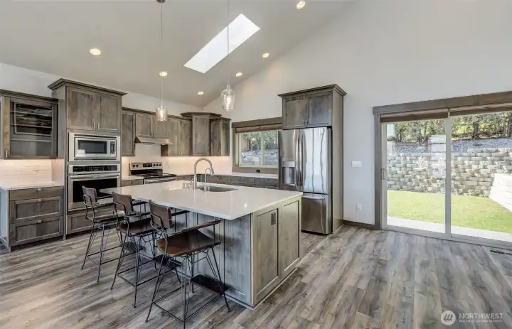 Kitchen island with seating AND Storage beneath the seating with river views, perfect for entertaining.