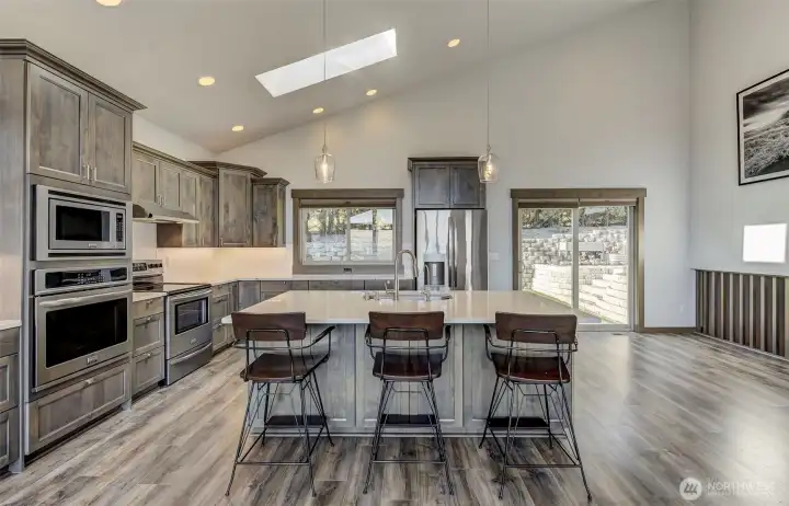 Kitchen island with seating and river views, perfect for entertaining.