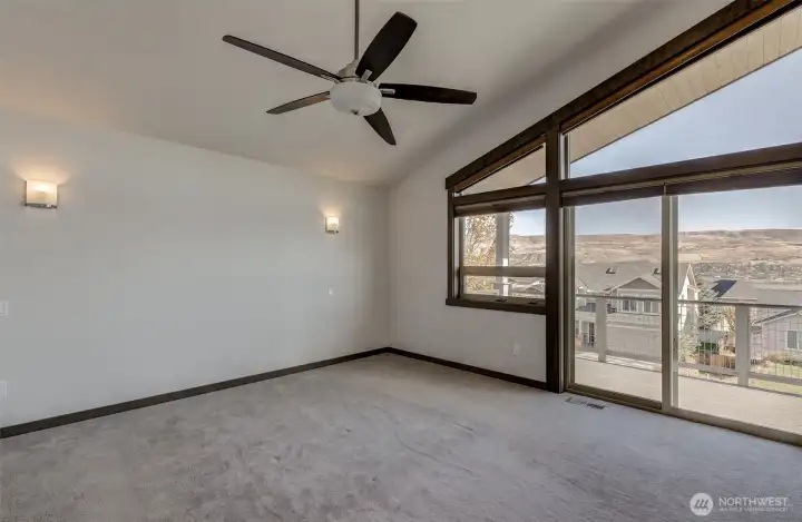 Primary bedroom with massive windows (electric blackout blinds) and unobstructed Columbia River views.