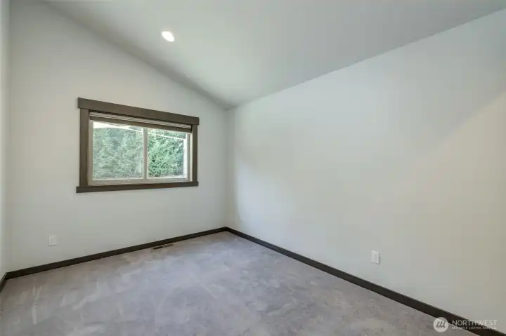 Third bedroom upstairs offering flexible space for guests or home office.