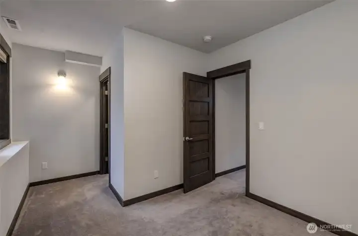 Fourth bedroom located on lower level, ideal for multi-generational living.