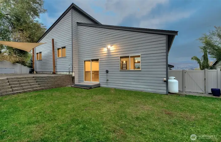 Large green lawn with irrigation & paver patio for entertaining