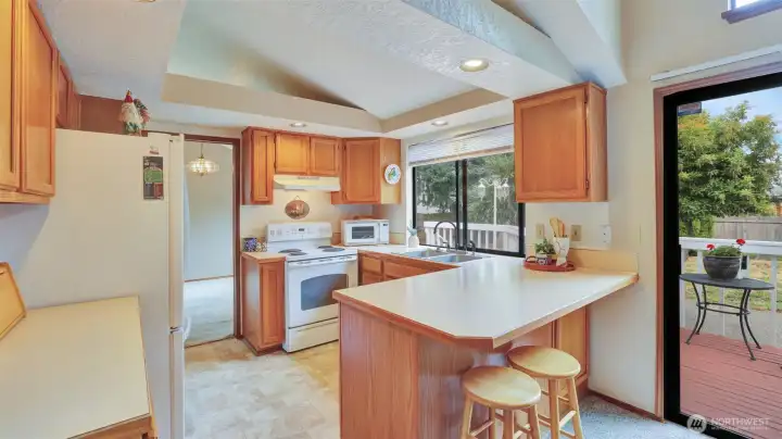 Deck is located right off kitchen.