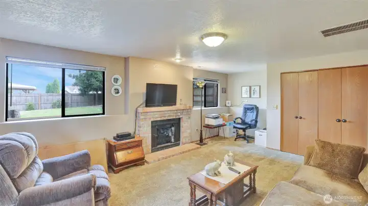 Wood burning fireplace in family room.