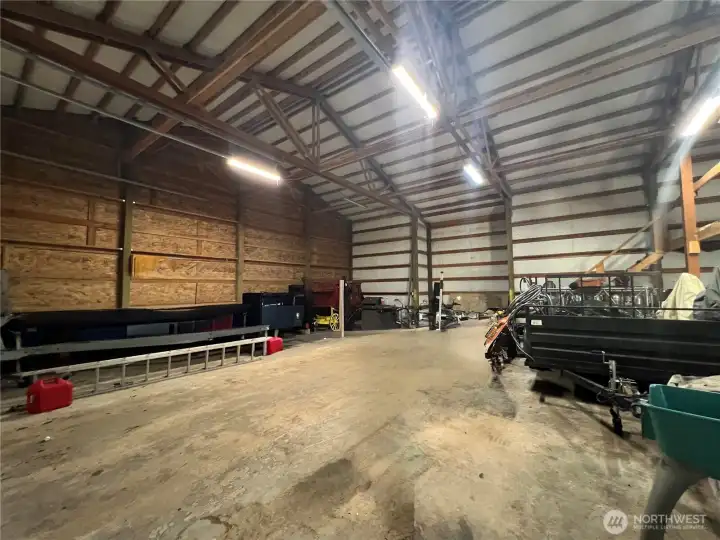 High ceilings, cement floor & elevated loft, make this building even larger inside than it appears from the outside.