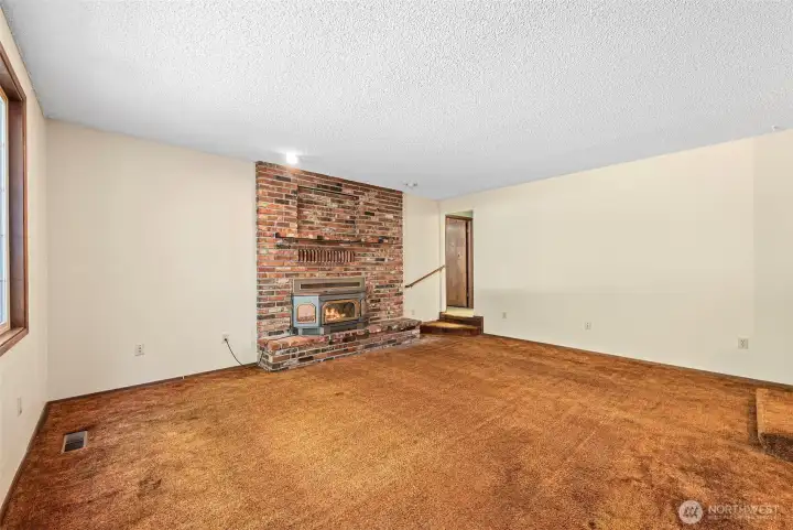 Step down living room upon entry.