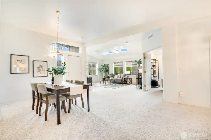 The living and dining room are open, airy and beautifully lit. Generously sized windows and well placed skylights provide great natural lighting