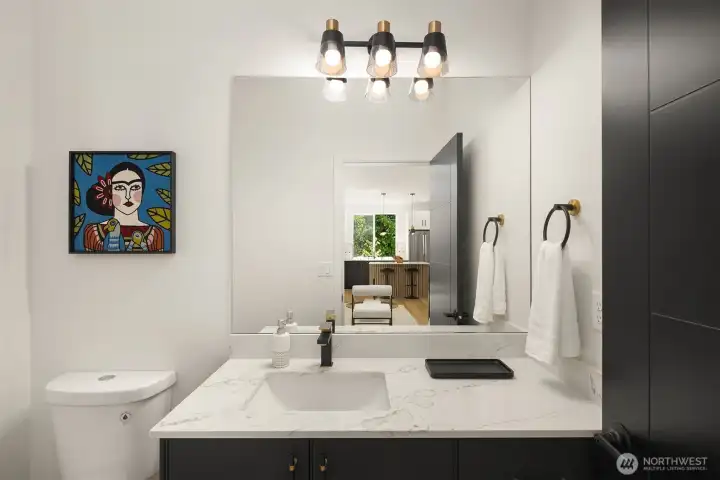 Half bath, perfect for guests  *Photos are of 8513A which features a similar floor plan