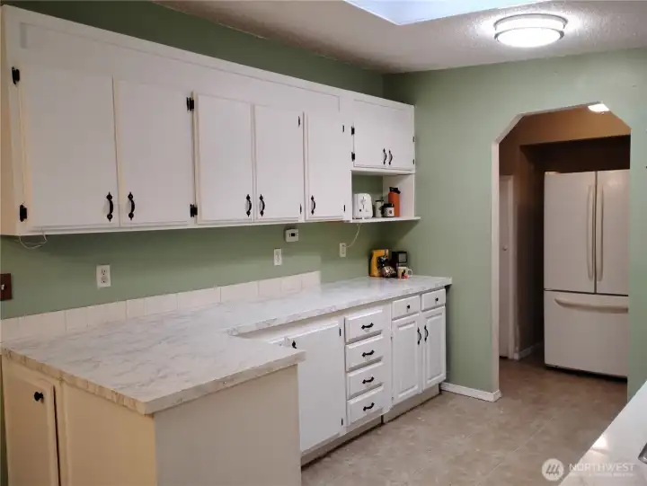 There will be more pictures to come.  The Kitchen has a fridge, oven, dishwasher and double sink.  There are two skylights in this home.  Plenty of outlets along the kitchen counters!