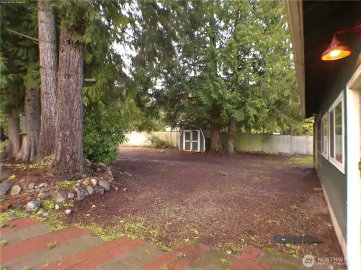 Very wide parking area in front of the garage and along the wide, private driveway