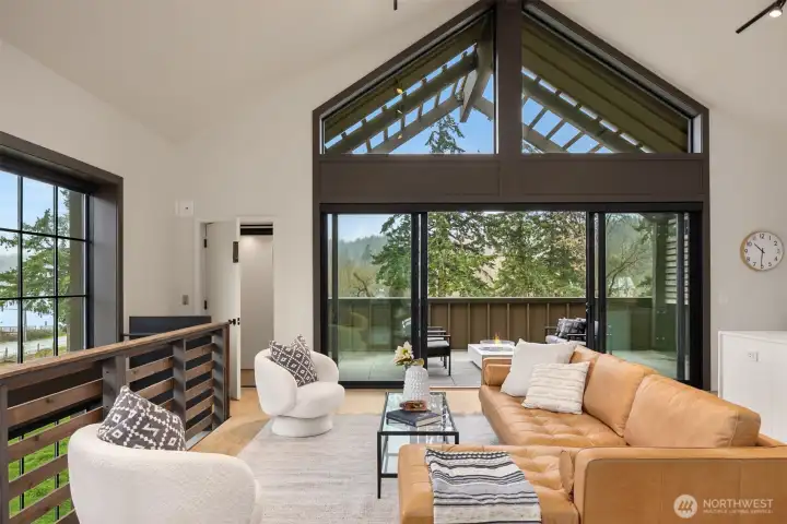 Pella doors open wide to a covered deck with views over Puget Sound's beautiful Rich Passage