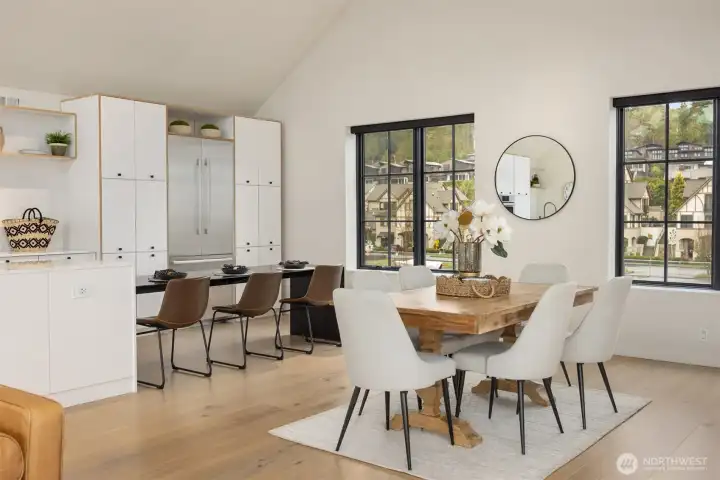 A custom steel table anchored to the island extends dining space for your guests