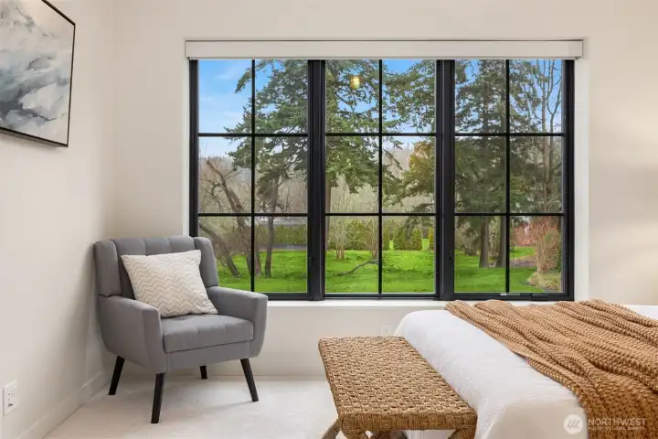 High ceilings and beautiful windows showcase the view