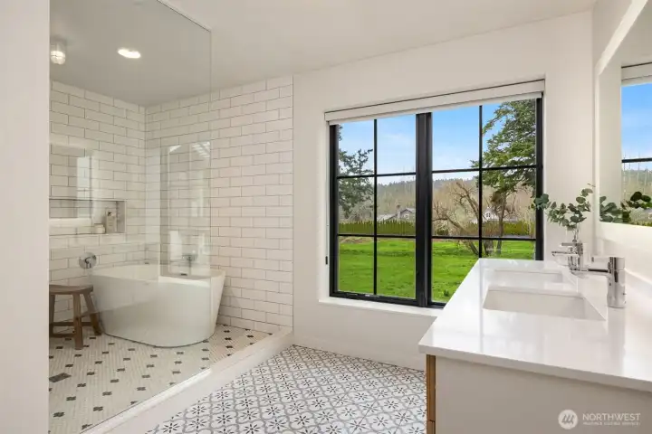 Spa-inspired with designer tile, heated floors, floating vanity with double sinks and quartz countertop...