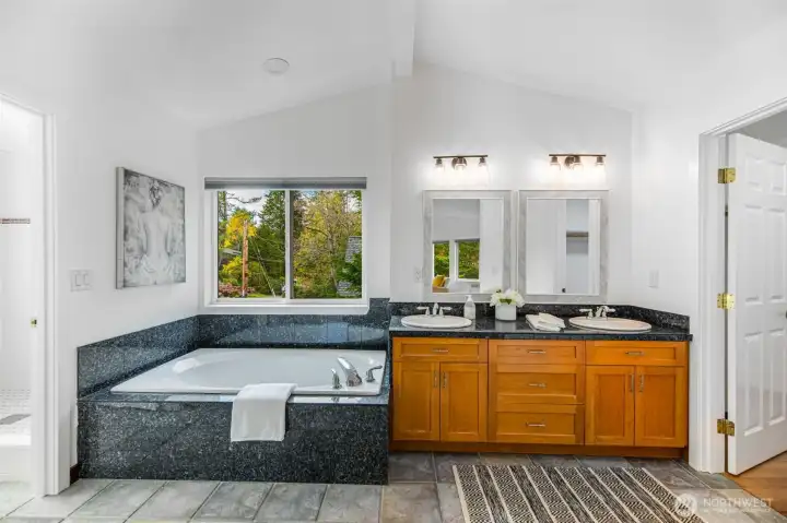 primary bath & tub, walk-in closet to right