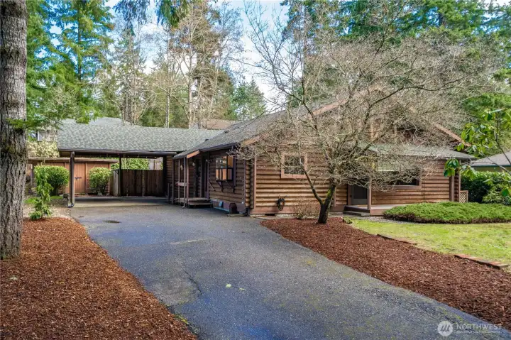 Long driveway + covered, attached carport provides tons of space for parking.