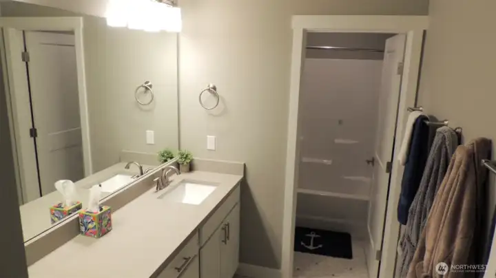 Upstairs bath with separate room with the Tub and Toilet.