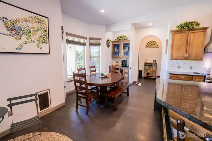 Bay window, wine/spirits bar and entry to primary bed or laundry room