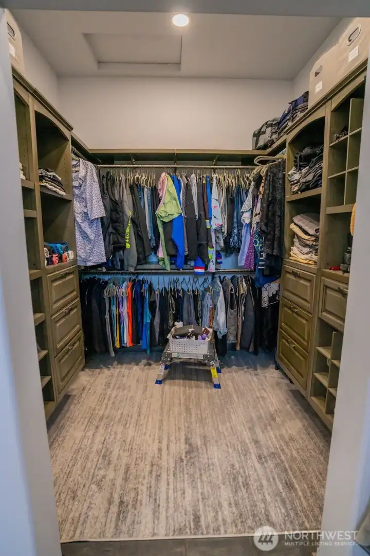 Full walk in closet with top quality built ins