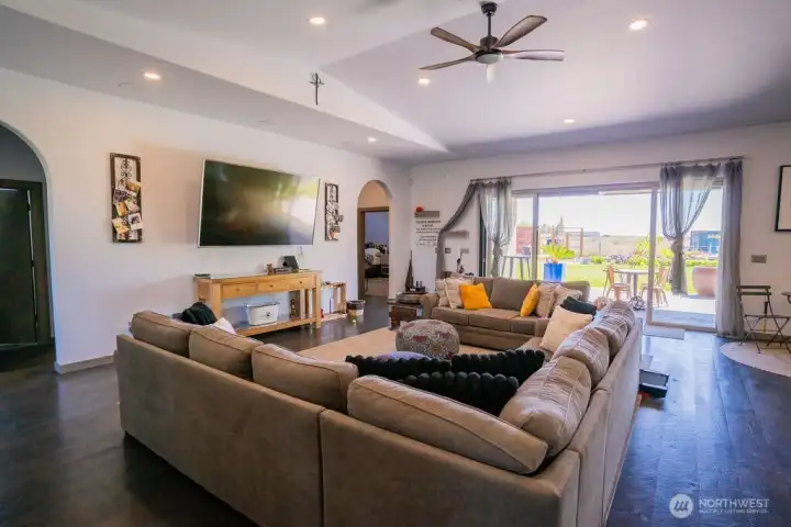 Living room looking into panorama doors leading to covered back patio