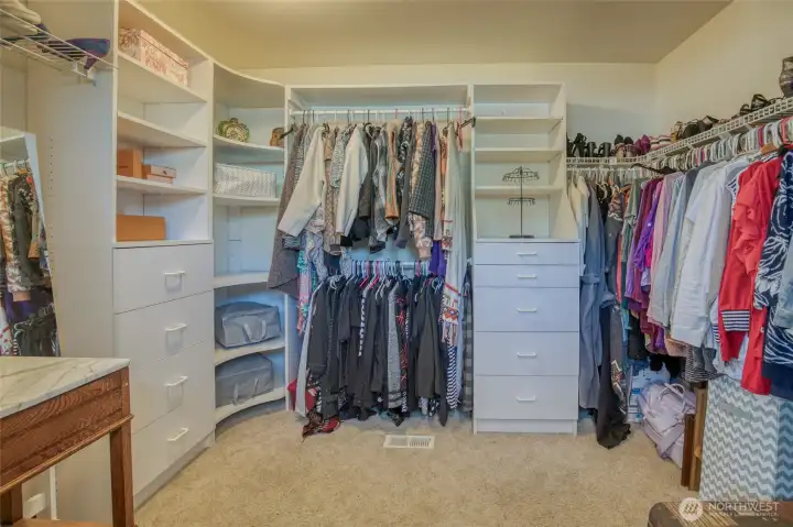 Very large walk-in closet with built in storage