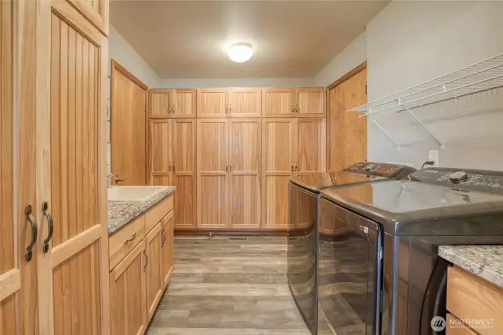 Large storage and pantry with pull out shelves for easy accessibility